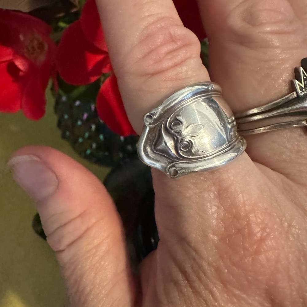 Silver spoon ring, size 8 1/2, not adjustable. Worn, see pictures.